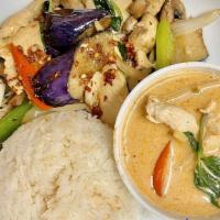 Red Curry · Flaming red curry with coconut milk, lime leaves, bell peppers, bamboo shoots, and fresh Tha...