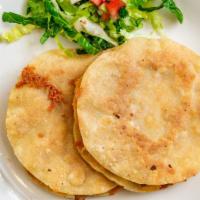 Mulitas · 2 pcs — Traditional sized crispy tortillas filled with chunks of meat and cheese, salad, & s...