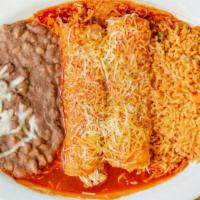 Enchiladas · 2 corn tortillas smothered in the sauce of your choice (Rojas/Suizas/Chipotle/Mole/a la Crem...