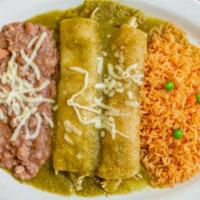 Enchiladas Suizas · 2 corn tortillas smothered in jalapeño & tomatillo sauce filled with meat, topped with mozza...