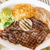 Carne Asada · Charbroiled steak served with rice, refried beans, salad, pico de gallo, grilled jalapeños &...