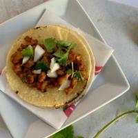Taco · Double soft corn tortillas, topped with your choice of meat, fresh cilantro & onion.