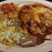 Two Tamales · Pork tamales topped with red enchilada sauce and cheese.