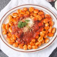 Gnocchi (Regular) · Tender potato pasta mixed with Romano cheese and meat sauce.