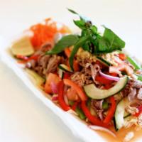 Nhoam · Gluten-free. Lettuce, basil, onion, cucumber, tomato, and cabbage tossed with fresh lime jui...