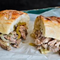 Porchetta Sandwich · Salumi’s version of classic Italian slow roasted pork.  Served in a giuseppe bread with our ...