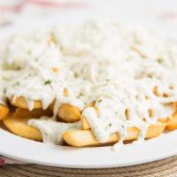 Greek Cheese Fries · Fries smothered in tzatziki sauce and feta cheese.