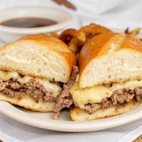 French Dip · Toasted french roll with melted garlic butter, thin sliced steak, swiss cheese, and au jus.