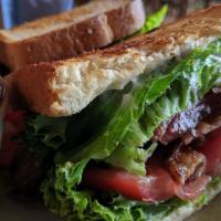 Blt · Toasted sourdough bread, lettuce, tomato, and applewood smoked bacon.