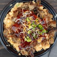 Bbq Pork Mac & Cheese · Mac and cheese with smoked pork, sliced scallions, and BBQ sauce.