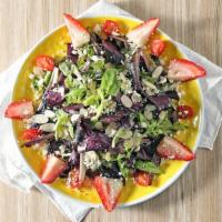 Strawberries Salad · Mixed greens, strawberries, feta cheese, almonds, cherry tomatoes, homemade strawberry vinai...