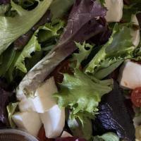 Caprese Inspired Salad · Mixed greens included baby spinach, Mozzarella, cherry tomatoes, basil, avocado, balsamic vi...