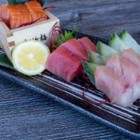 Triple Sashimi · Raw. 3 pieces salmon, tuna, and yellowtail.