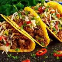 Beef Taco · Hard shell taco full of fresh beef, lettuce and cheese.