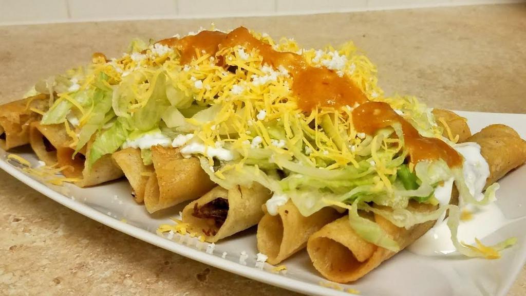 Rolled Tacos With Cheese · Three Rolled Tacos Full of Fresh Beef and served with Cheese.