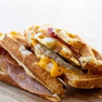 Loaded Breakfast Waffle · (Sausage, Bacon, Ham, 2 Cracked Egg, Cheese)