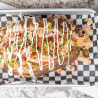 Loaded Smoked Potato · Pork, brisket, chicken or fried chicken baked potato loaded with choice of meat, cheese, chi...