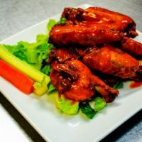 Chicken Wings · 8 Chicken wings with your choice of Sauce