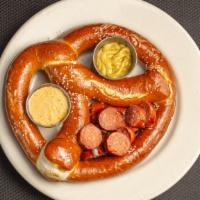 Bretzel & Brat · Bavarian pretzel with spicy andouille sausage, brown mustard, and cheese sauce.
