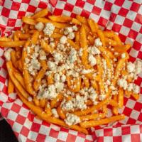 Buffalo Fries · Tossed in buffalo sauce, topped with crumbled blue cheese and blue cheese dressing.