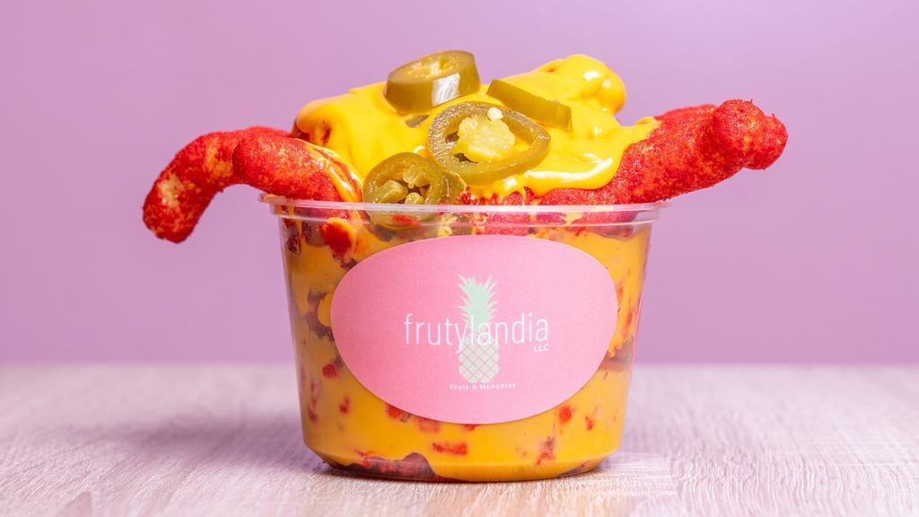 Queso Cup · Your choice of 2 chips (Tostitos, Hot Cheetos, Cheeto Puffs, Doritos, Takis) smothered in nacho cheese and jalapeños