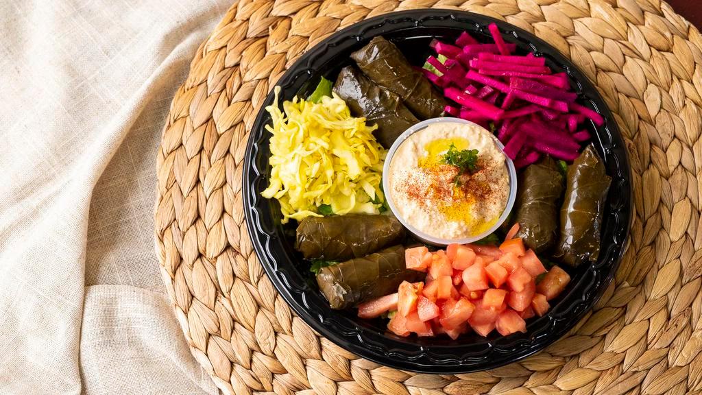 Grape Leaves (6 Piece) (Full Order) · Stuffed with rice, onions, spices, and served with hummus.