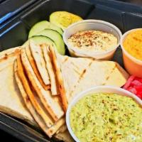 Hummus Trio (Full Order) · Red, green and classic hummus.