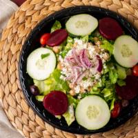 Greek Salad · Romaine lettuce, tomatoes, cucumbers, onions, kalamata olives, chickpeas, beets, and feta ch...