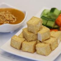 Satay Tofu · Fried Tofu, Cucumber and Carrot served with house made satay sauce (spicy peanut sauce).