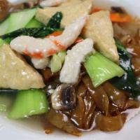 Stir-Fried Flat Noodle With Sauce · Flat rice noodle, soy-shrimp, tofu, mushroom, bok choy, carrot top with white sauce.