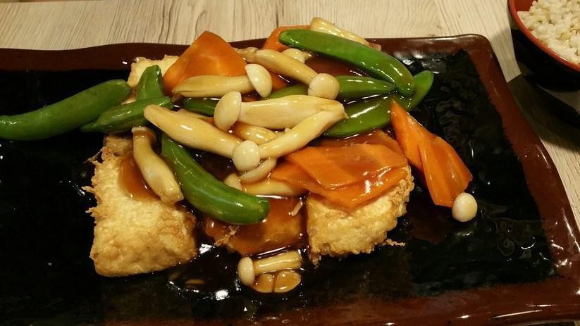 Village Tofu · Fried-tofu, snow peas, shimeji mushrooms, red peppers with brown sauce.