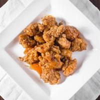 Mandarin Chicken · Chopped up chicken deep-fried in a thin garlic hot sauce. Hot and spicy.