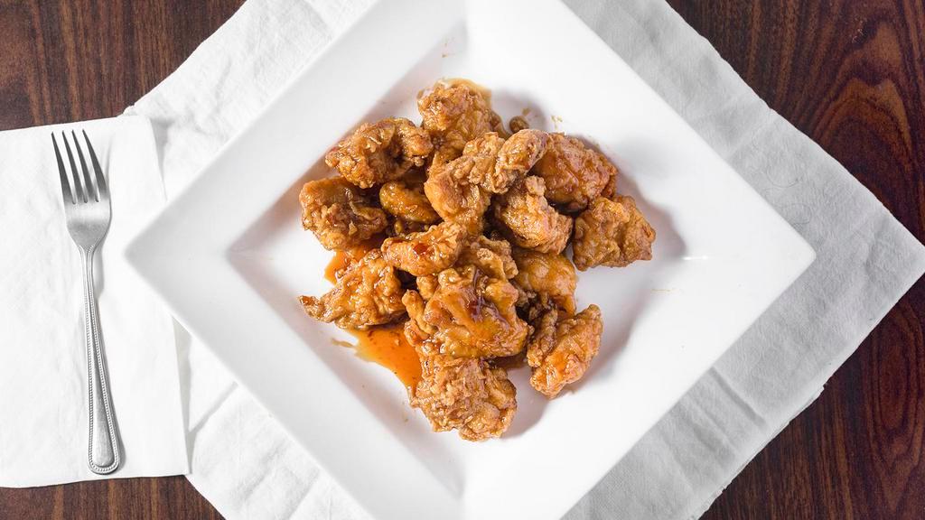 Mandarin Chicken · Chopped up chicken deep-fried in a thin garlic hot sauce. Hot and spicy.