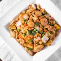 Cashew Nut Chicken · Stir-fried with vegetables topped with cashew nuts.