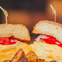 El Hefty (Breakfast Sandwich) · Disclaimer: bacon is an add up. 4 eggs scramble, 5 cheese mix, tomato, mayo, onion. On a cha...