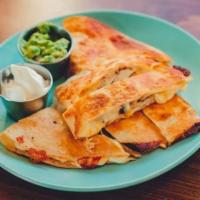 Chicken Quesadilla · Big flour tortilla toasted to a crispy perfection with melted 5 cheese blend folded, with ro...