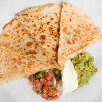 Quesadillas · Flour tortilla with cheese served with a side of lettuce, sour cream, guacamole, and pico de...