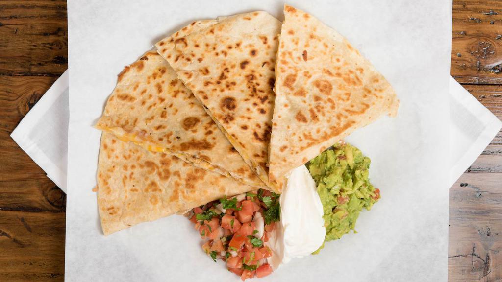 Quesadillas · Flour tortilla with cheese served with a side of lettuce, sour cream, guacamole, and pico de gallo.