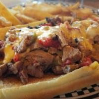 Beef Brisket Philly · Toasted hoagie with beef brisket, sauteed onion, jalapenos and red peppers topped with our h...