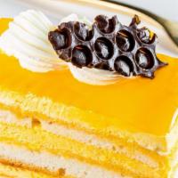 Moksha Mango · The ultimate mango cake with amazing flavor and texture, topped with fluffy flavorful mango ...