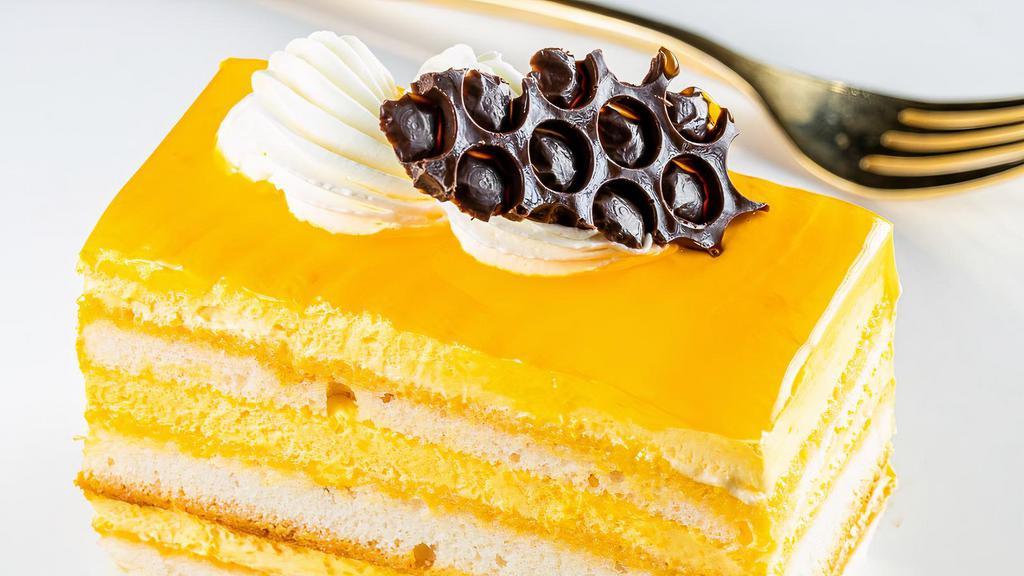 Moksha Mango · The ultimate mango cake with amazing flavor and texture, topped with fluffy flavorful mango frosting.