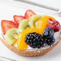 Fruit Tart · Pastry shell filled with custard and cream,  topped with fresh mixed fruit.