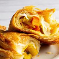 Vegetable Puff · Potatoes, carrots, green peas, and mild spice,  wrapped and baked in buttery puff pastry!