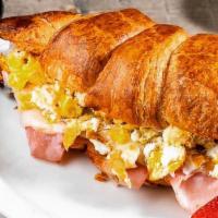 Breakfast Croissantwich · Ham, Scrambled Egg & Provolone Toasted on one of our Signature Butter Croissants