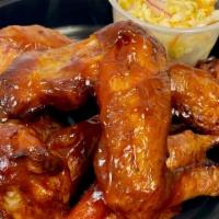 Lawless Wings · Brined and seasoned large chicken wings wood smoked then fried, choice of Alabama White barb...