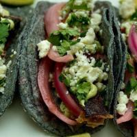 Brisket Tacos · 3 tacos with Three Sisters blue corn tortillas, smoked Prime Angus brisket, charred red sals...