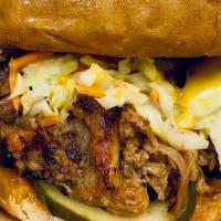 Pulled Pork Sandwich · Toasted Brioche bun, incredible smoked sauced ＆ seasoned pulled pork shoulder, Tangy Vinegar...