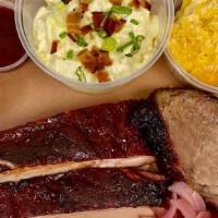 2 + 2 Plate · Choose two slow-smoked meats and two homemade sides.