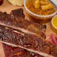 ½ Rack Of Ribs Plate · Half a rack of our slow-smoked then grilled and sauced Kansas City style pork spare ribs and...