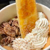 Banana Pudding · Scratch-made banana pudding topped with candied pecans, vanilla bean whipped cream, mini Nil...